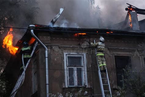 Firefighters Extinguish a Fire in an Old House Stock Photo - Image of ...