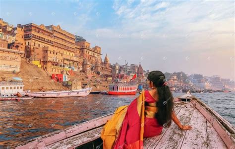 Female Tourist Enjoy Boat Ride At Varanasi Ganges | India Stock Photo