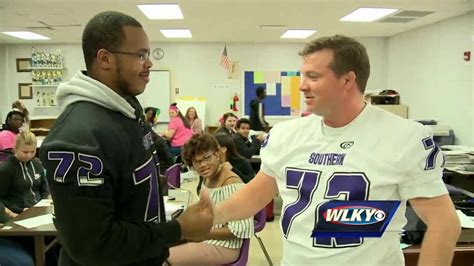 Southern High School football players "give away" jerseys