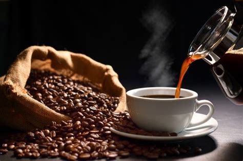 Pouring Coffee With Smoke On A Cup And Coffee Beans On Burlap Sack On Black Background | Coconut ...