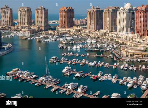 The Pearl in Doha. View of the Marina and residential buildings in Porto Arabia Doha Stock Photo ...