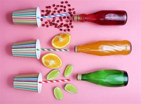 Premium Photo | Different fruit drinks with fresh fruits on pink background