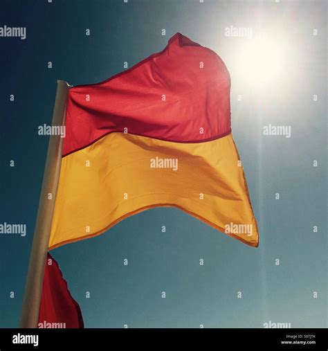 Beach red and yellow flag hi-res stock photography and images - Alamy