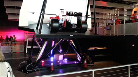 Race car motion simulator Theme Park, Race Cars, Motion, Racing, Drag Race Cars, Running, Auto ...