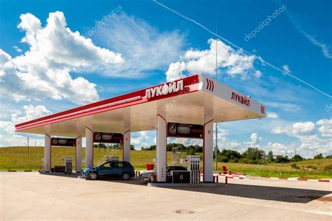 Lukoil gas station with fueling cars – Stock Editorial Photo © blinow61 #144405195