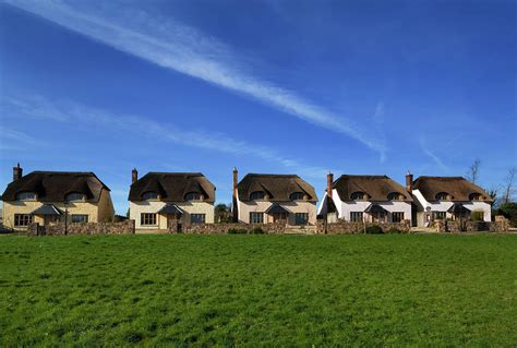 Upmarket Ghost Estate Of Thatched Photograph by Panoramic Images - Fine Art America