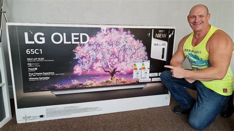 2021 65" LG C1 OLED Unboxing,wall mounting & demo! - YouTube