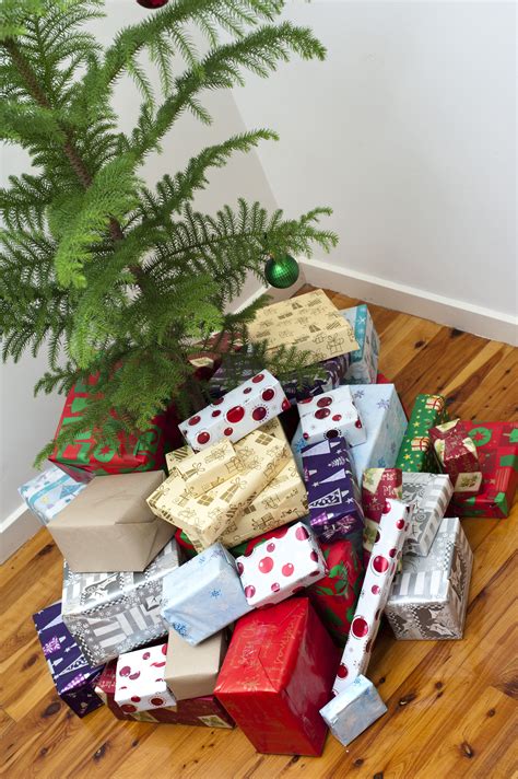 Photo of Large collection of Christmas gifts under a tree | Free christmas images