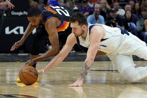 Luka Doncic held back from Suns fan after 'reckless' taunt