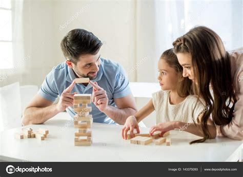 Family playing jenga game — Stock Photo © NatashaFedorova #143375093