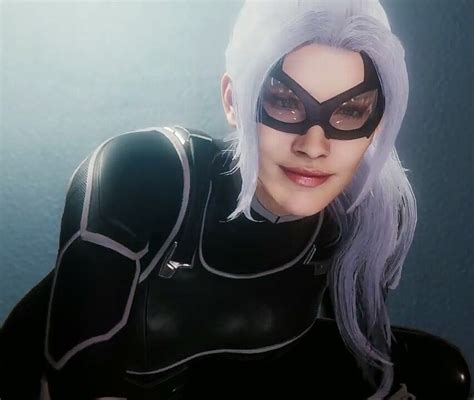 a woman with white hair wearing a catwoman costume