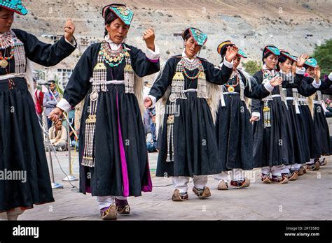 Ladakh, India, September 4, 2018: Group of dancers in traditional clothes performing on festival ...