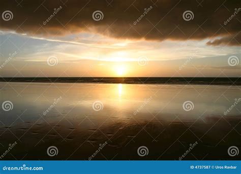 Sunset and dramatic clouds stock image. Image of sand - 4737587