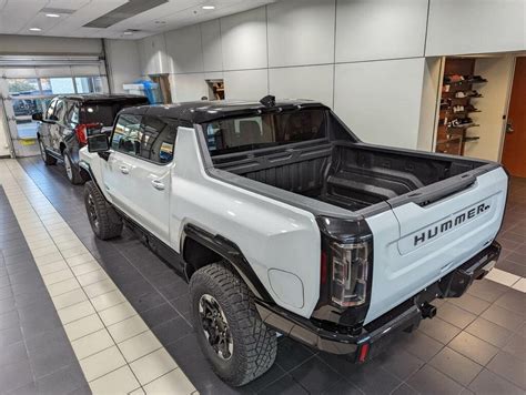 GMC Hummer EV sports its massive size alongside full-size SUV