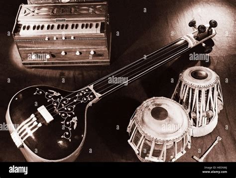 Indian classical music instruments - Tabla, Harmonium, Tamboori Stock Photo - Alamy