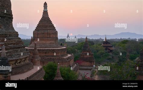 View of ancient buddhist temples in Bagan at sunset Stock Photo - Alamy