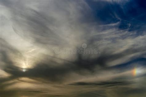 Fluffy Clouds with Little Rainbow Stock Photo - Image of landscape ...