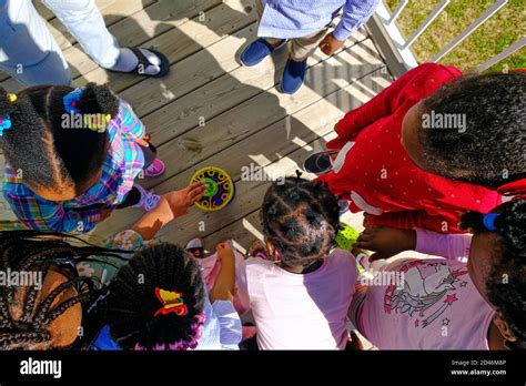 African American Nigerian Children Playing with bubble machine Stock Photo - Alamy