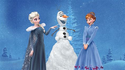 two frozen princesses standing next to each other in front of a snow covered tree
