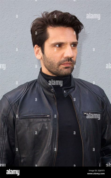 MIAMI, FL - FEB 16: Turkish actor Kaan Urgancioglu poses outside during Mira Quien Baila All ...