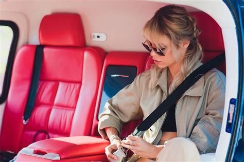 Premium Photo | Female pilot in cockpit of helicopter before take off young woman helicopter pilot