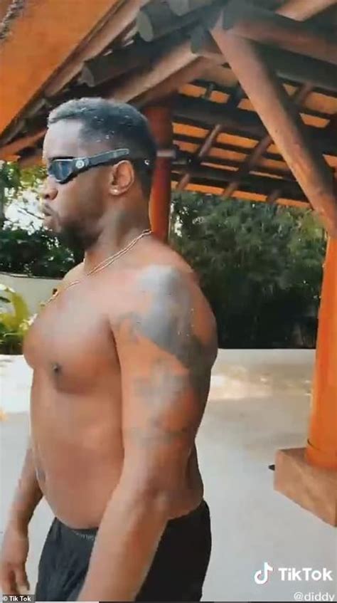 Sean 'Diddy' Combs goes shirtless for a walk in Miami Beach... after ...