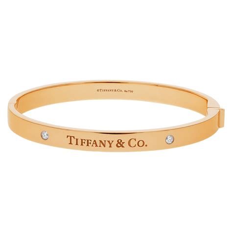 Tiffany & Co. Hinged bangle with two diamonds in 18k yellow