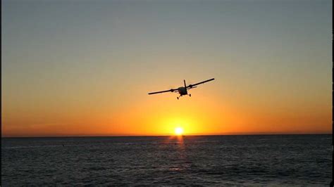 Winair low buzz job takeoff at sunset, SXM Princess Juliana Airport - St. Maarten - YouTube