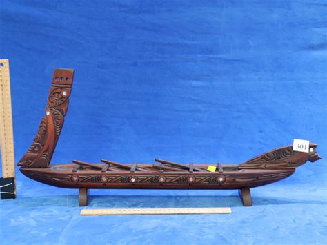 Sold Price: LARGE WOODEN REPLICA OF NEW ZEALAND MĀORI WAKA/WAR CANOE, INCLUDING 4 OARS AND STAND ...