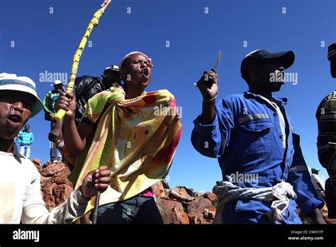 CARLETONVILLE, SOUTH AFRICA: Thousands of striking Gold Fields miners gather near the Anglo Gold ...