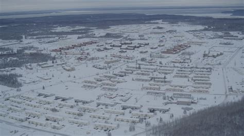 4K stock footage aerial video snow covered Fort Richardson residential ...