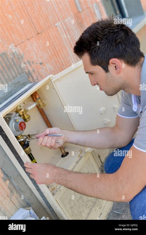 Fixing the water meter Stock Photo - Alamy