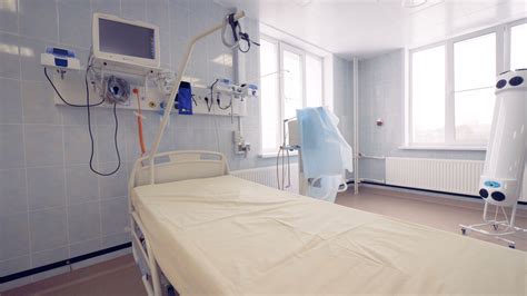 General view of a hospital room with a single bed and modern medical ...