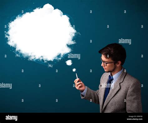 Young man smoking unhealthy cigarette with dense smoke Stock Photo - Alamy