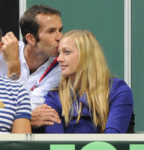 Smile of fortune: Petra Kvitova and Radek Stepanek kissing in the stands