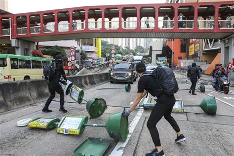 Hong Kong plunged into commuter chaos as protesters block roads and ...