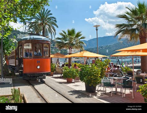 Soller Tram Historic traditional tram passing sea front cafes and ...