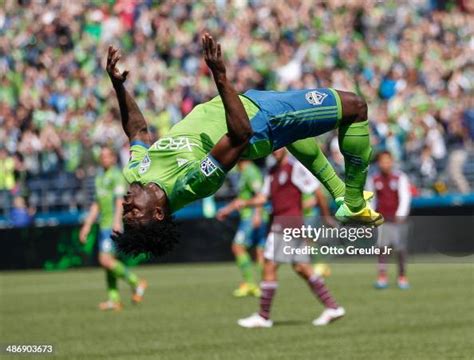 Obafemi Martins of the Seattle Sounders FC does a back flip after... News Photo - Getty Images