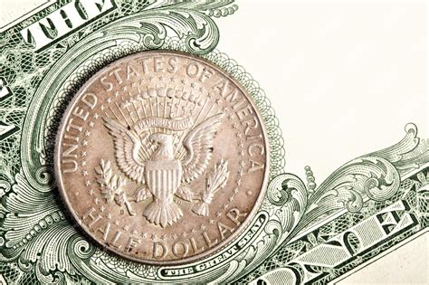 Premium Photo | Dollar coin and banknote