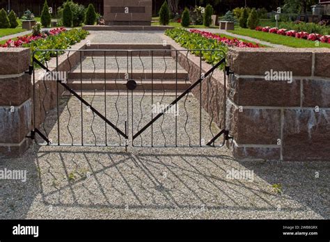 Old wrought iron entrance gates to cemetery Stock Photo - Alamy