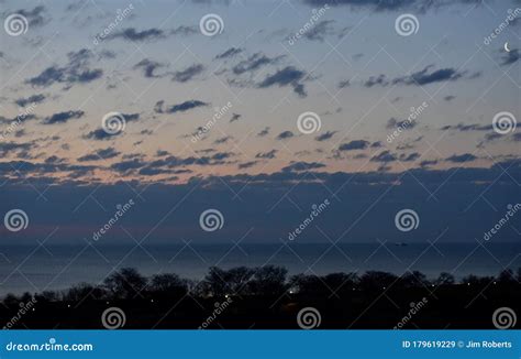 Crescent Moon in the Clouds Stock Image - Image of crescent, clouds ...