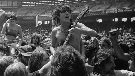 The 1970s - Angus Young AC/DC : r/OldSchoolCool