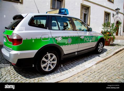 A BMW police car parked on a street in Fussen in Allgau, Bavaria ...