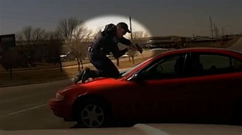 Traffic stop turns into terrifying chase with cop on top of speeding ...