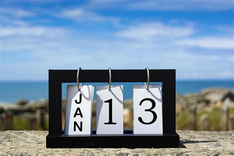 Jan 13 calendar date text on wooden frame with blurred background of ...