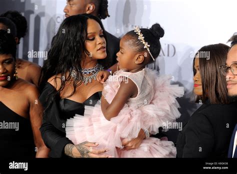 Rihanna and her family attend Rihanna's 3rd Annual Diamond Ball ...