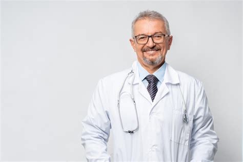 Premium Photo | Horizontal portrait of serious mature male doctor or therapist in white medical ...