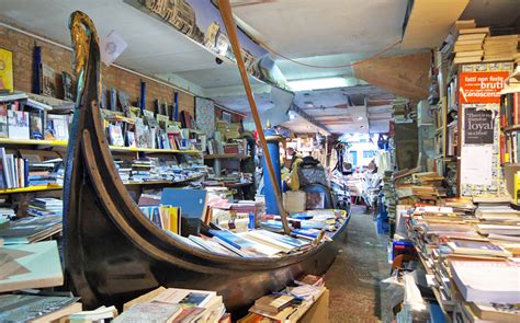 libreria-acqua-alta-bookshop-venice-boat - The Culture Map