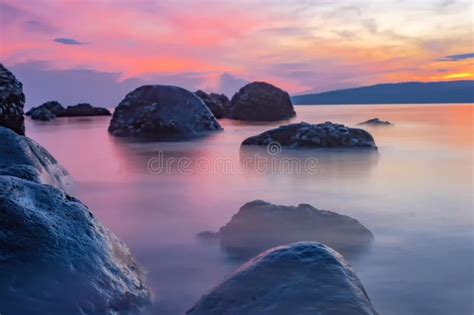 Rocky Beach and the Sunrise in the Morning Stock Image - Image of rocky ...