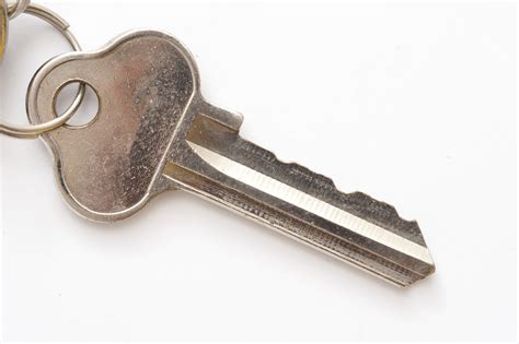 Free Image of Silver house key on white | Freebie.Photography